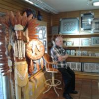 John waiting for Bob to finish shopping