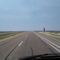 Cowboy silhouettes on roadside