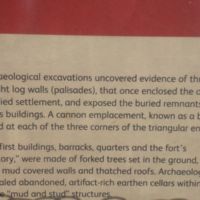 Buildings of forked trees, mud-covered walls