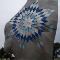 The star quilt represents respect, honro, and admiration in Native American cultures. The diamonds flutter in the wind and are lit at night.